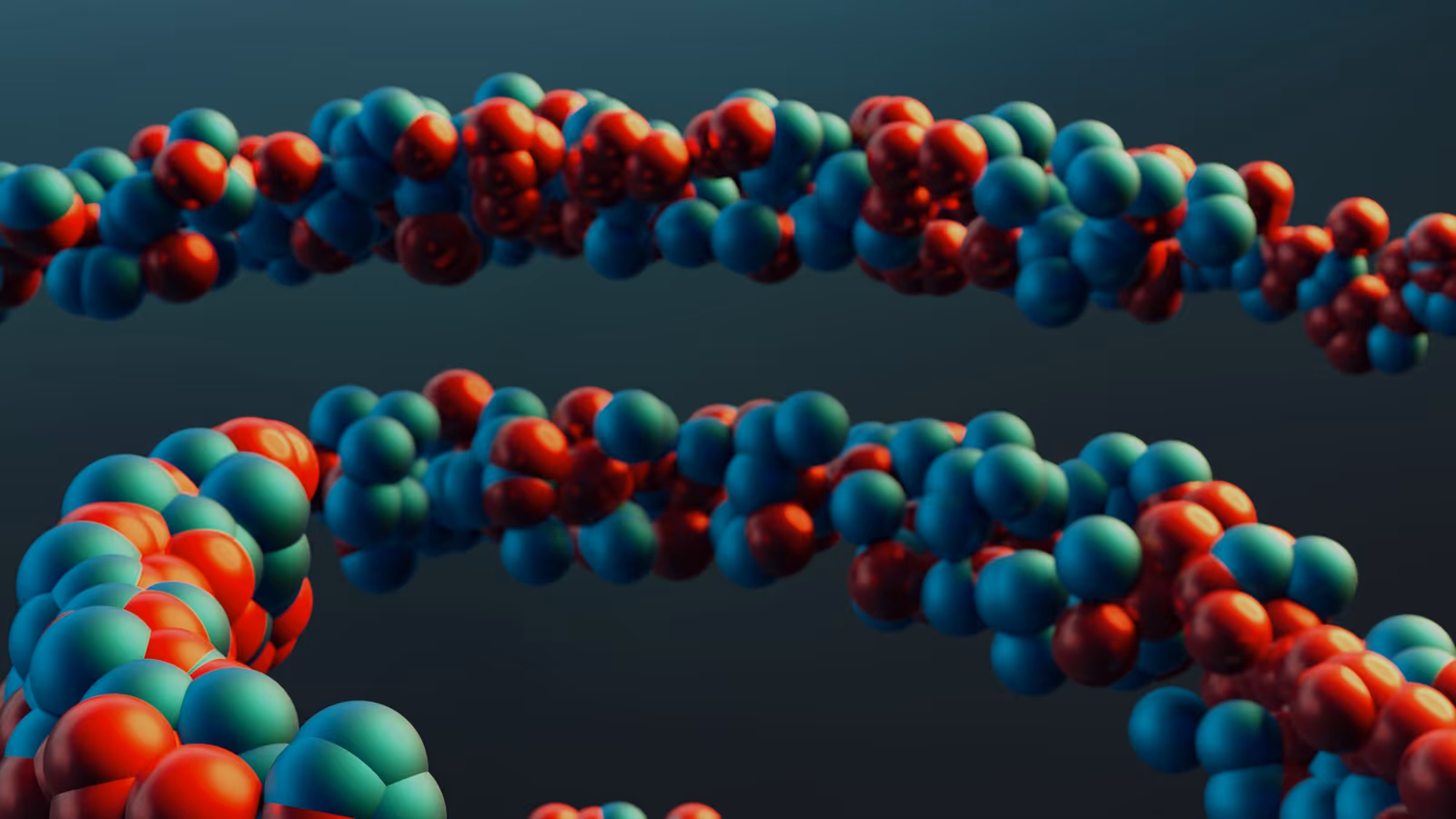 Representação molecular artística com esferas vermelhas e turquesa conectadas sobre fundo escuro.